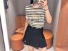  Chân váy ngắn xếp ly đen, gấu trắng, cạp chữ chạy 