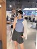  Áo CDG trắng kẻ sọc dọc, họa tiết gấu xanh 