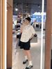  Áo sơ mi trắng tay lửng , cổ thắt nơ cà vạt, cúc đen Logo 