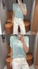  Áo Xanh ngọc chữ CC ngực - gấu ADORE trắng 
