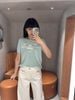  Áo Xanh ngọc chữ CC ngực - gấu ADORE trắng 