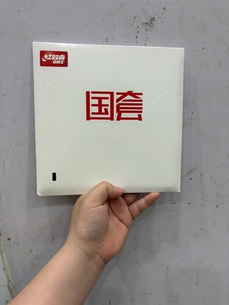Mặt vợt DHS H3 tuyển Quốc Gia thường lót cam ( vỏ trắng) 39 độ, dày 2.2mm màu đen