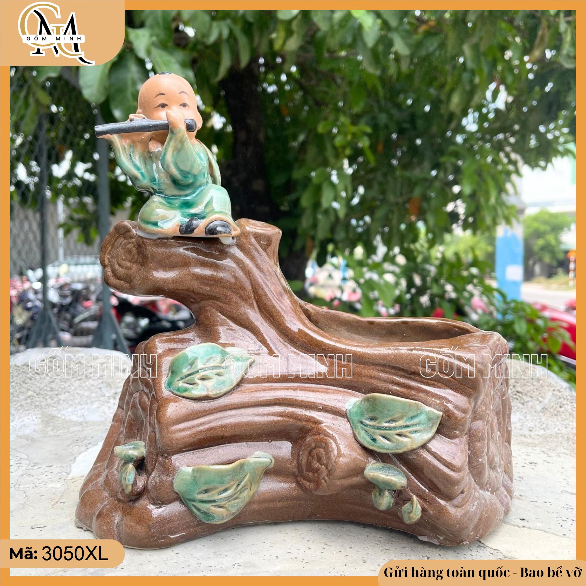 Chậu tượng chú bé thổi sáo gốc cây