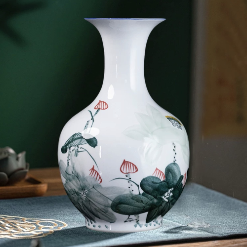  Bình hoa ánh sen trăng để bàn Chất liệu gốm sứ Sử dụng đồ trưng bày  Kt 22*35; d đáy 13cm d miệng ngoài 14cm d miệng trong 6cm 