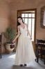 Đầm maxi xoè cột dây khoét eo