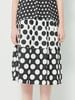 Chân váy chấm bi màu đen trắng