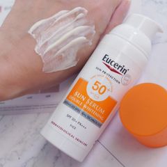 Combo Eucerin Kem chống nắng Sun Serum Spotless Brightening SPF50+ PA++++ 50ml + Sensitive Skin Dermato Clean 100ml