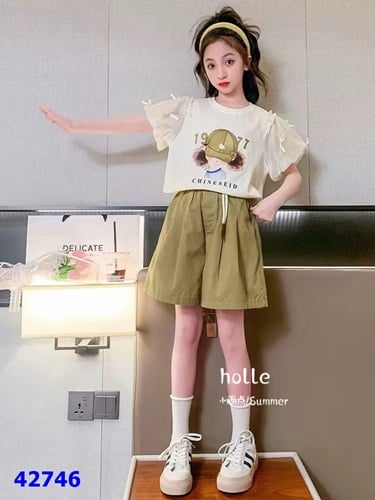 Bộ ngắn cô gái tay voan nơ kem xanh - size 130