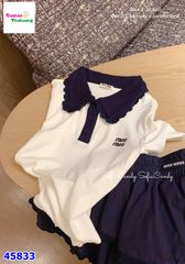 Set MiaKid Polo trắng Miumiu, chân váy tầng xanh