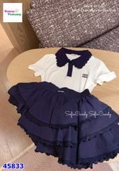 Set MiaKid Polo trắng Miumiu, chân váy tầng xanh