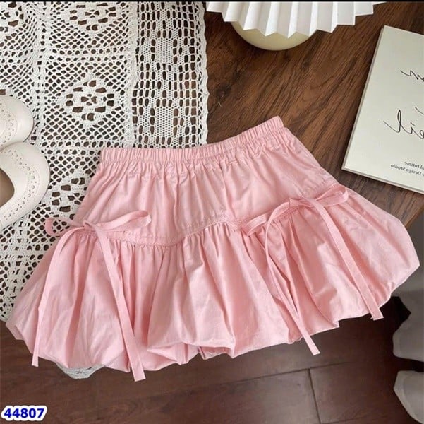 Chân váy bí hồng đính nơ