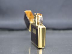 Zippo 1997 mạ vàng ốp emblem hổ phách C740