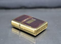 Zippo 1997 mạ vàng ốp emblem hổ phách C740