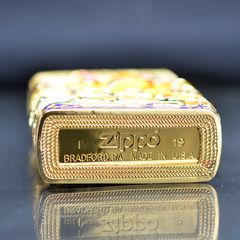 Zippo Mỹ xuất Nhật bọc vàng ốp Trâu Chiến dạ quang ZN340