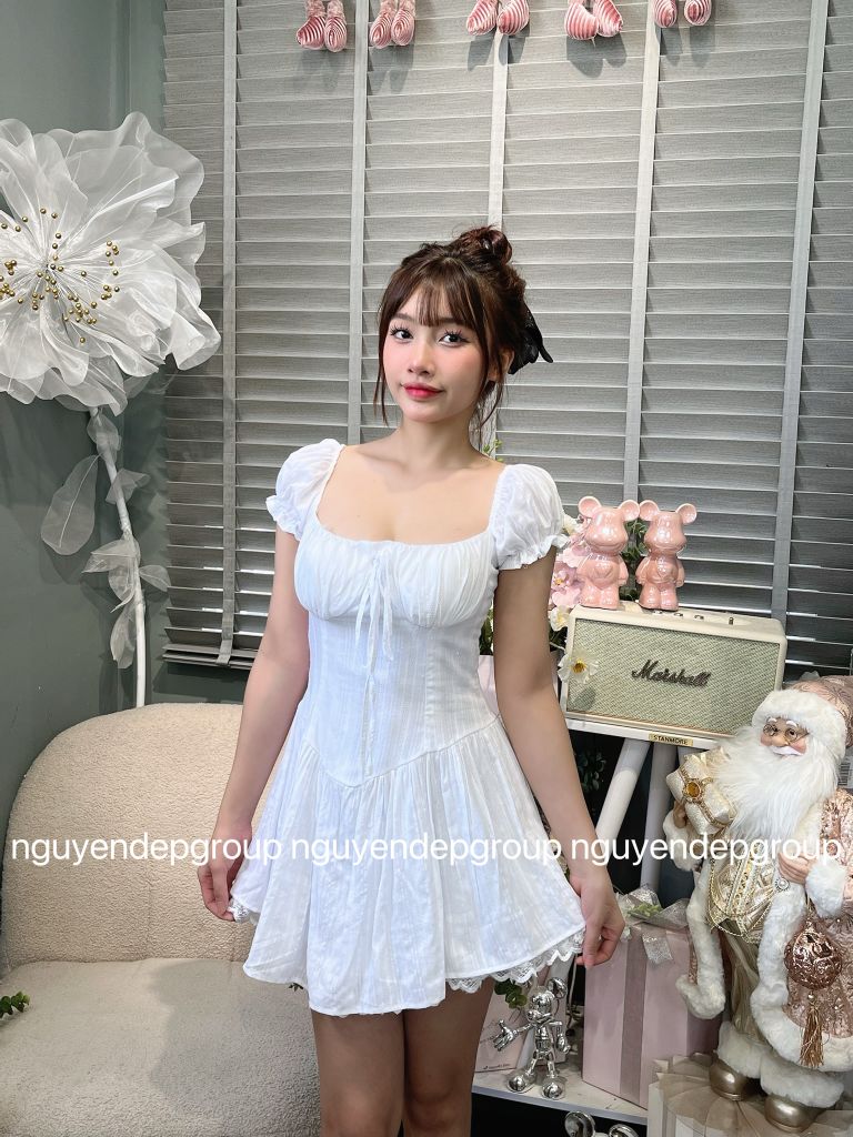 Đầm xòe nhún ngực tay phồng cột nơ